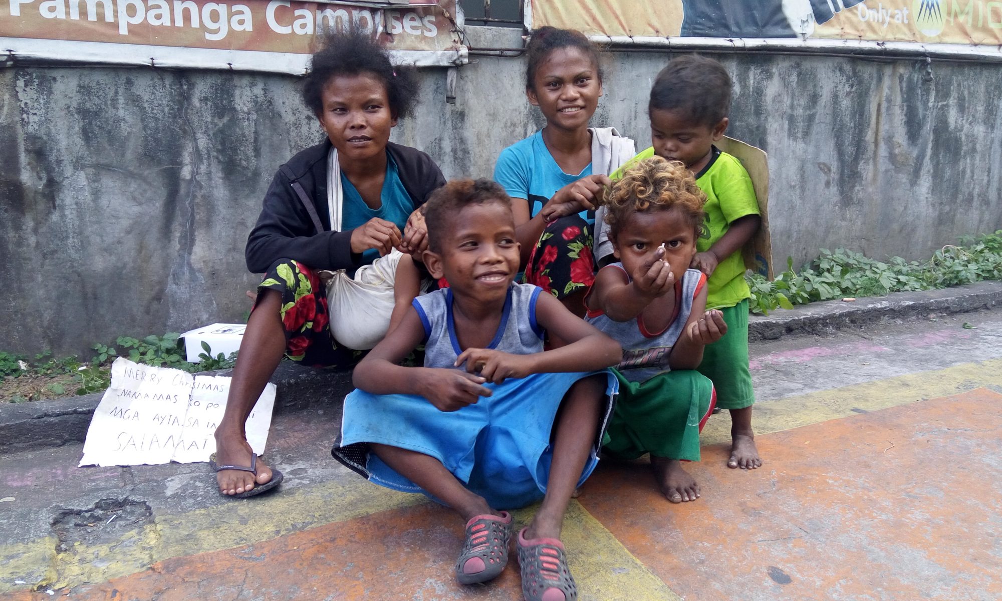 Homeless Ayta family begging in Metro Manila streets